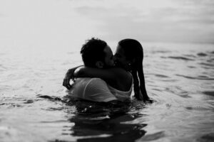 Couples Kissing On The Beach